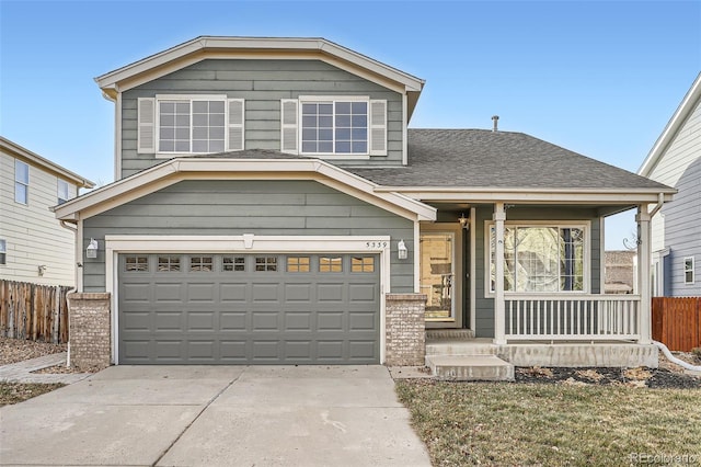 view of front of home featuring covered porch and a garage