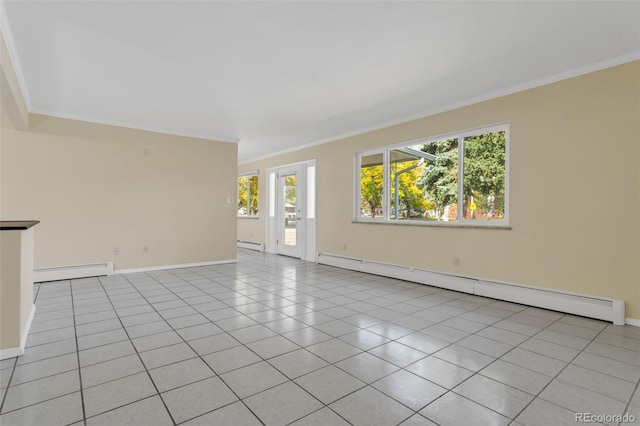 spare room with light tile patterned floors, ornamental molding, and a baseboard heating unit