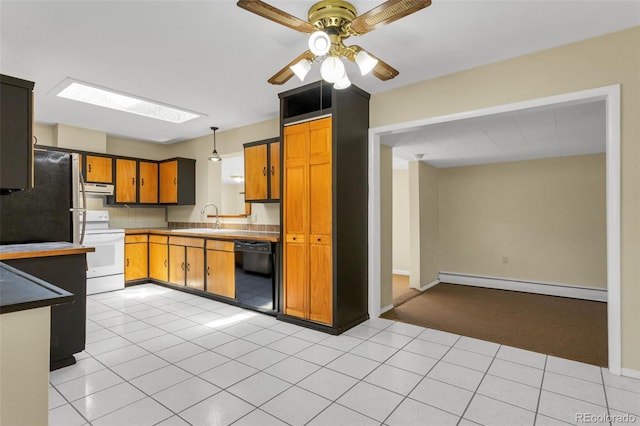 kitchen featuring a baseboard heating unit, black appliances, hanging light fixtures, a skylight, and range hood