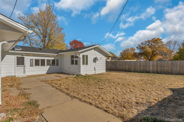 exterior space featuring a lawn and a patio