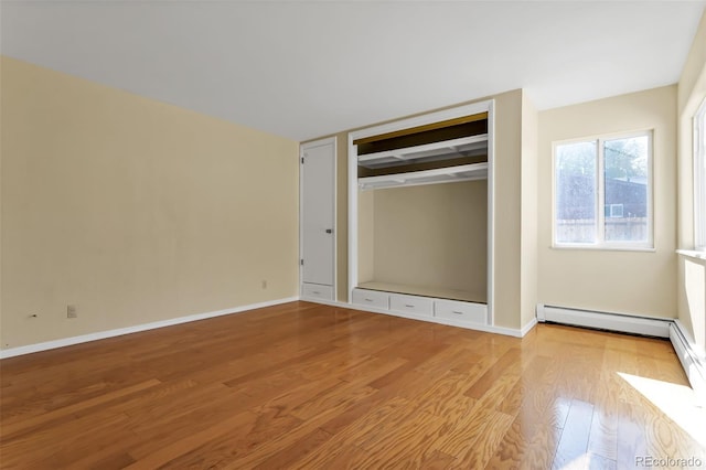 unfurnished bedroom with a closet and light wood-type flooring