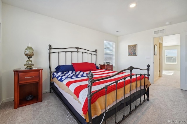 bedroom with light colored carpet