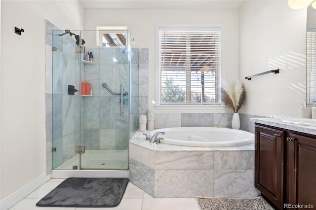 bathroom featuring vanity, tile patterned floors, and separate shower and tub