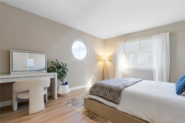 bedroom with light hardwood / wood-style floors