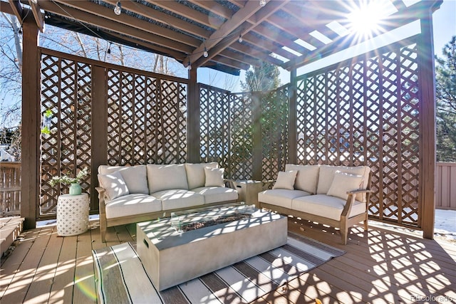 wooden terrace with a pergola and an outdoor hangout area