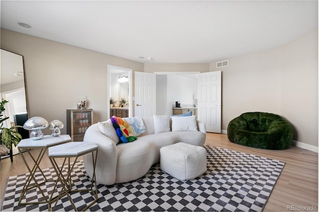 living room with light hardwood / wood-style floors