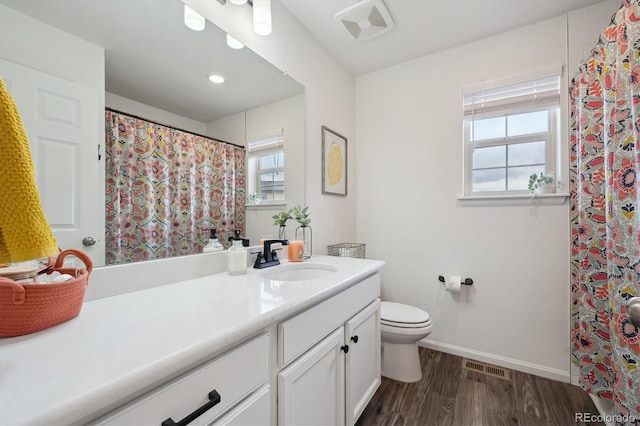 full bathroom featuring visible vents, a wealth of natural light, and wood finished floors