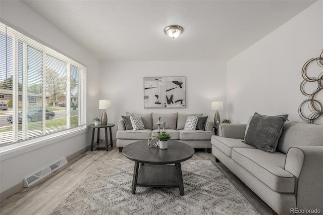 7828 Florado St, Denver, CO 80221 - living room featuring wood finished floors and baseboards