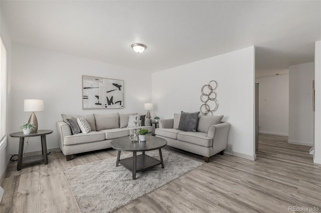 7828 Florado St, Denver, CO 80221 - living area with wood finished floors and baseboards