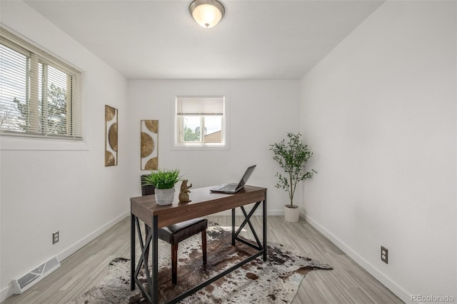 7828 Florado St, Denver, CO 80221 - office area featuring light wood-style flooring and baseboards