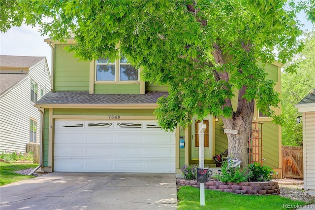 7840 S Windermere Cir, Littleton, CO 80120 - view of front of house featuring concrete driveway, a garage, and roof with shingles