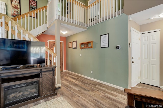7840 S Windermere Cir, Littleton, CO 80120 - foyer featuring baseboards, wood finished floors, and stairway
