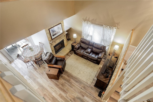 7840 S Windermere Cir, Littleton, CO 80120 - living room featuring a fireplace and wood finished floors