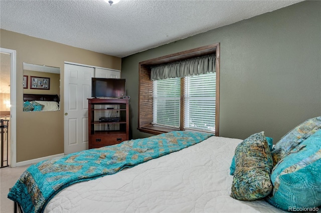 7840 S Windermere Cir, Littleton, CO 80120 - carpeted bedroom with a textured ceiling and a closet