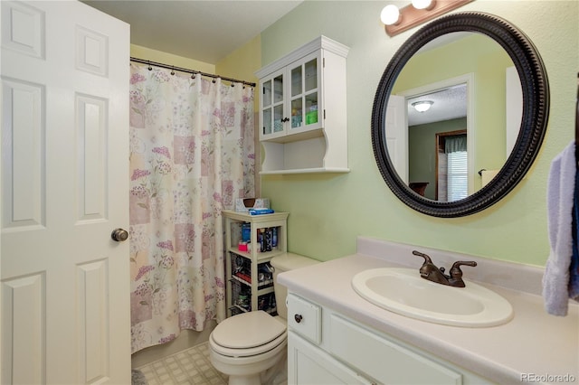 7840 S Windermere Cir, Littleton, CO 80120 - bathroom featuring vanity, toilet, and a shower with shower curtain