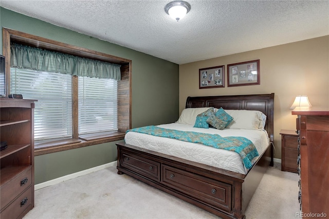 7840 S Windermere Cir, Littleton, CO 80120 - bedroom with light carpet, baseboards, and a textured ceiling