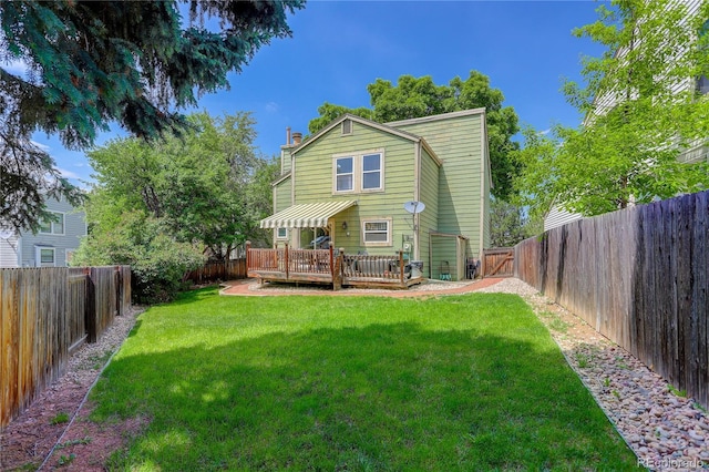 7840 S Windermere Cir, Littleton, CO 80120 - back of property with a deck and a chimney