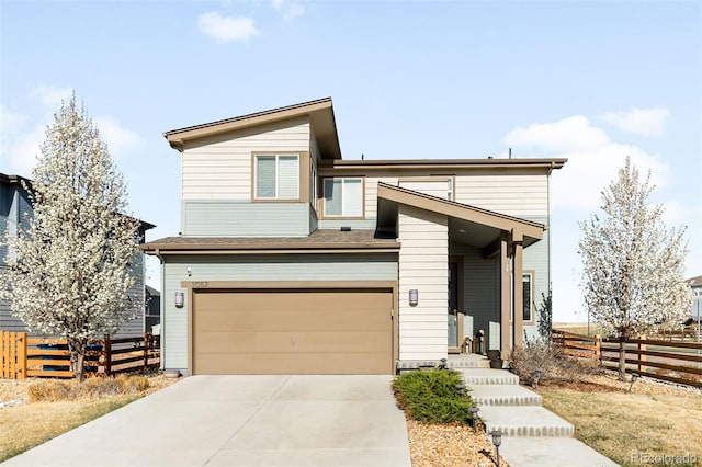 11052 Sedalia St, Commerce City, CO 80022 - view of front of property with driveway, a garage, and fence