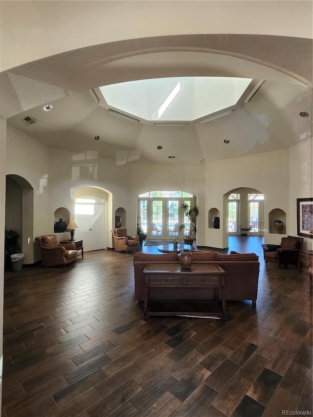 living room featuring vaulted ceiling and dark hardwood / wood-style flooring