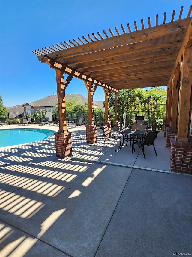 view of patio / terrace with a fenced in pool and a pergola