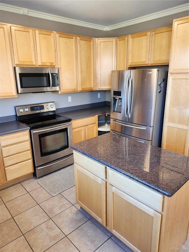 kitchen with light brown cabinetry, crown molding, appliances with stainless steel finishes, and light tile patterned floors