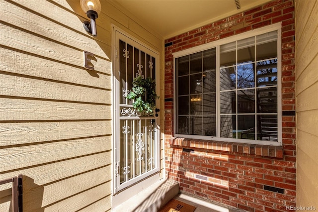 doorway to property featuring covered porch