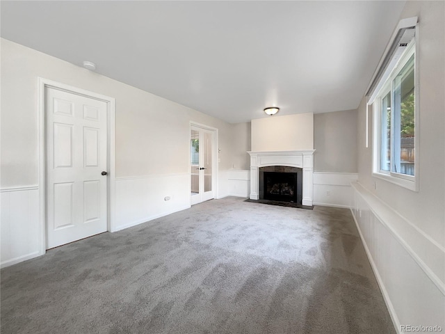 unfurnished living room with carpet floors