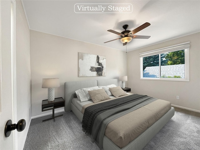 bedroom featuring ceiling fan and carpet