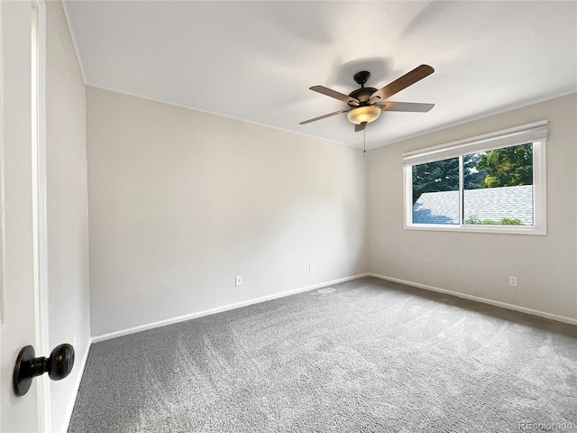 empty room featuring ceiling fan and carpet flooring