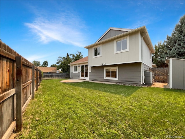 back of property featuring a lawn and a patio