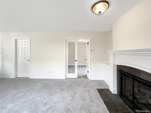 unfurnished living room featuring carpet floors