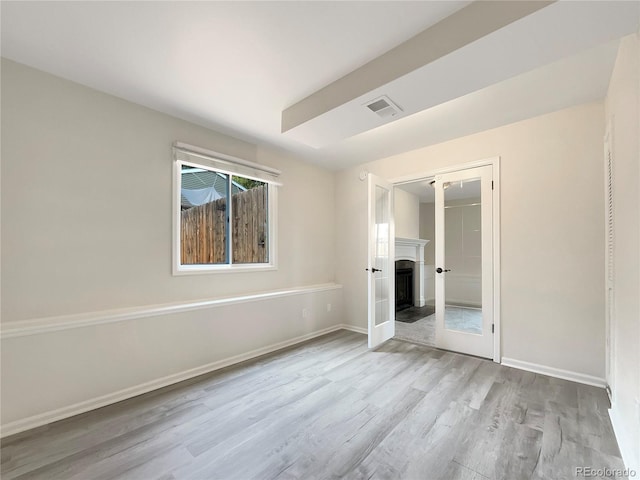 unfurnished bedroom featuring a closet and light hardwood / wood-style flooring