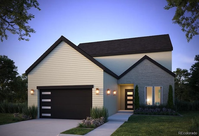 1740 Barefoot Dr, Windsor, CO 80550 - view of front of home with an attached garage, concrete driveway, and a front yard