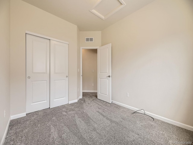 600 E Dry Creek Pl, Littleton, CO 80122 - unfurnished bedroom with attic access, carpet flooring, and a closet