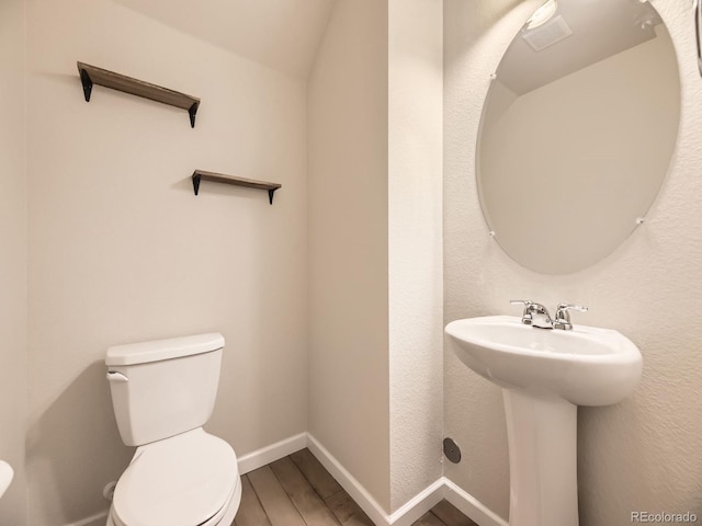 600 E Dry Creek Pl, Littleton, CO 80122 - half bathroom with toilet and wood finished floors