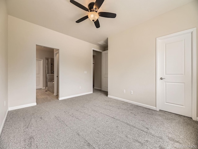 600 E Dry Creek Pl, Littleton, CO 80122 - unfurnished bedroom featuring light carpet, ensuite bathroom, and ceiling fan
