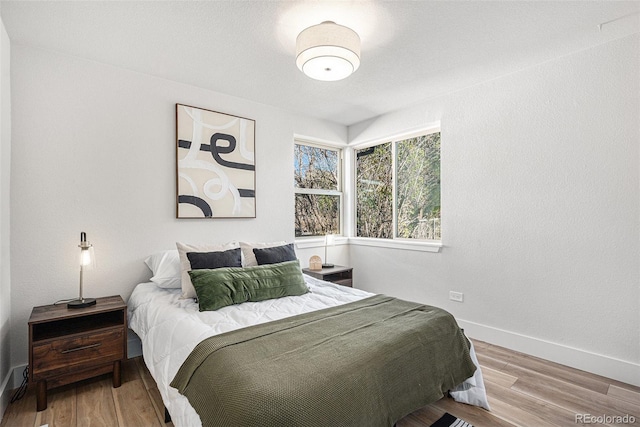 bedroom featuring hardwood / wood-style flooring