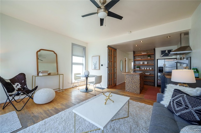 3735 Inca St, Denver, CO 80211 - living area featuring ceiling fan, wood finished floors, and baseboards