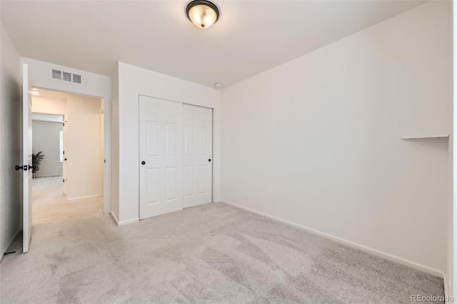 4433 N Picadilly Ct, Aurora, CO 80019 - unfurnished bedroom with light carpet, a closet, and baseboards