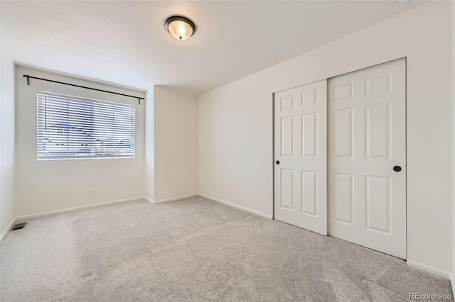 4433 N Picadilly Ct, Aurora, CO 80019 - unfurnished bedroom with carpet flooring, baseboards, and a closet