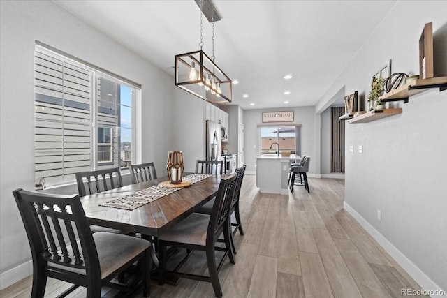 3344 Evening Pl, Castle Rock, CO 80109 - dining space with light wood finished floors, baseboards, and recessed lighting