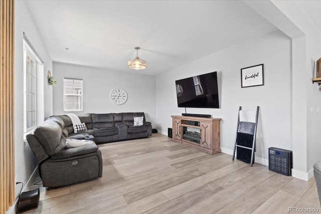 3344 Evening Pl, Castle Rock, CO 80109 - living area featuring light wood-type flooring and baseboards
