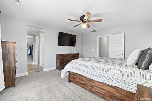 3344 Evening Pl, Castle Rock, CO 80109 - carpeted bedroom with a walk in closet, baseboards, ceiling fan, and a closet