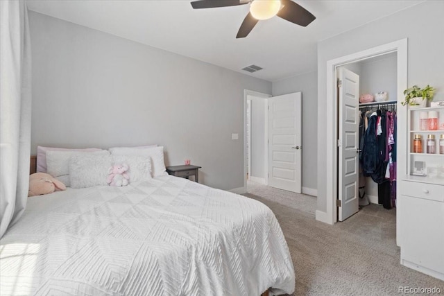 3344 Evening Pl, Castle Rock, CO 80109 - carpeted bedroom with a walk in closet, ceiling fan, baseboards, and a closet