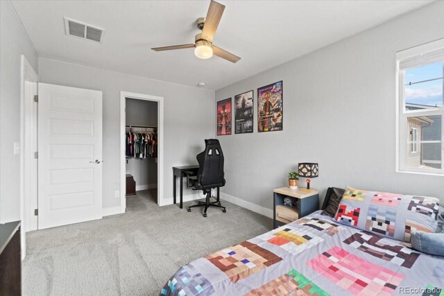 3344 Evening Pl, Castle Rock, CO 80109 - bedroom with carpet flooring, baseboards, a walk in closet, a closet, and a ceiling fan