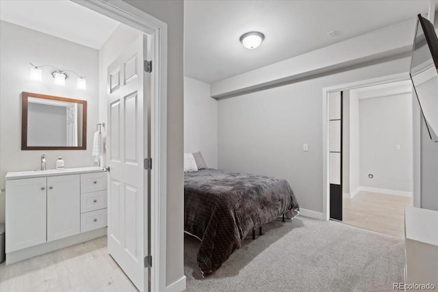 3344 Evening Pl, Castle Rock, CO 80109 - bedroom featuring a sink, light carpet, and baseboards