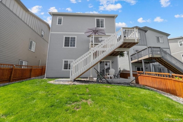 3344 Evening Pl, Castle Rock, CO 80109 - rear view of house with stairway, a wooden deck, and a patio