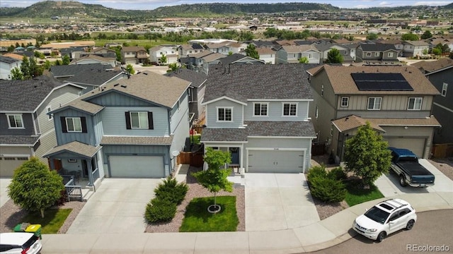 3344 Evening Pl, Castle Rock, CO 80109 - view of front of home with a residential view, driveway, a mountain view, and an attached garage
