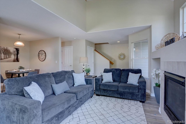12812 Jasmine St Unit D, Thornton, CO 80602 - living area featuring light wood-style floors and a tile fireplace