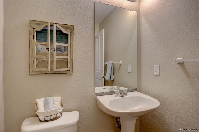 12812 Jasmine St Unit D, Thornton, CO 80602 - bathroom featuring toilet and a sink